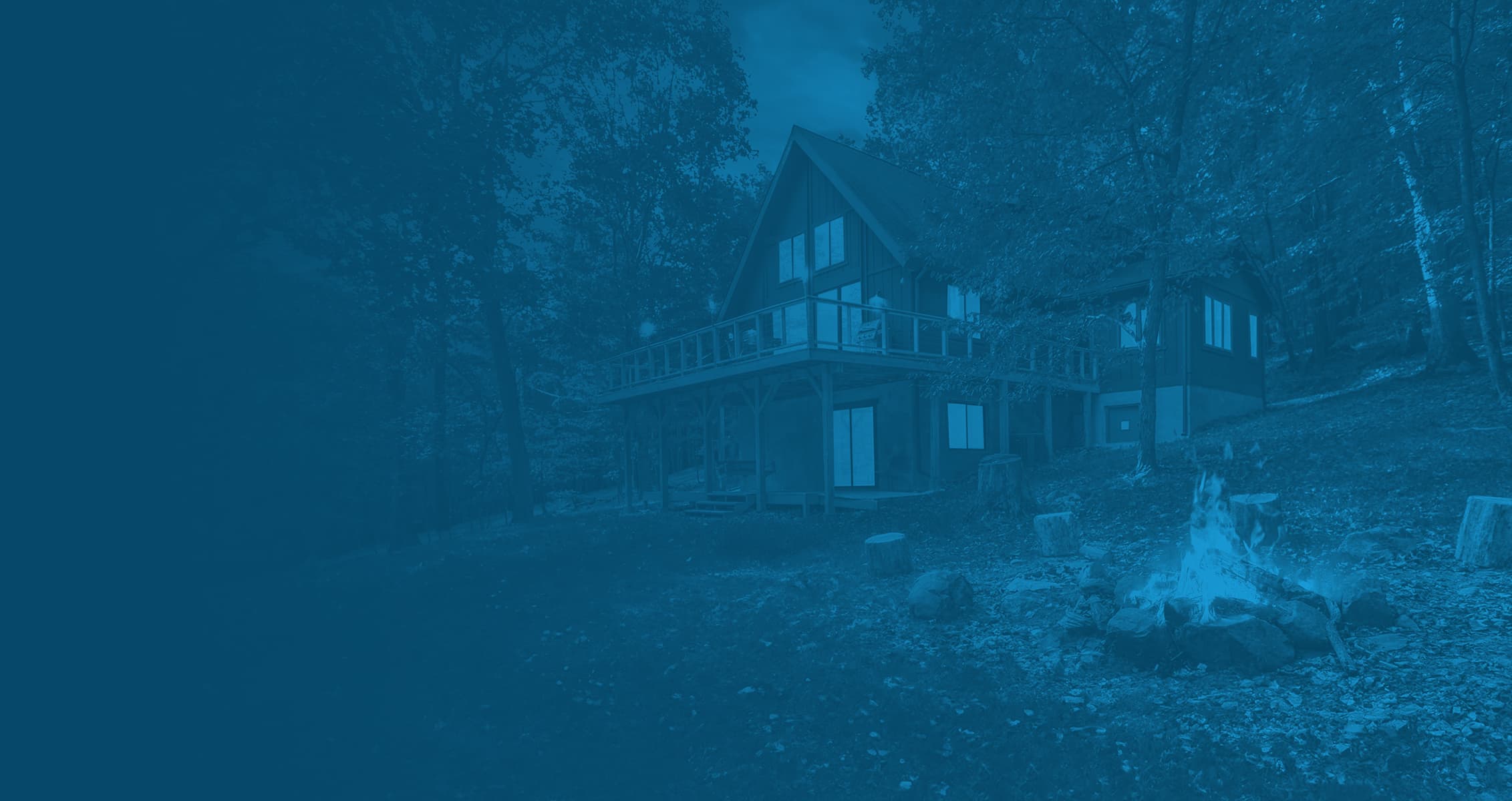 A Blue Maple cabin surrounded by trees in West Virginia