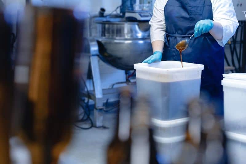 wp-content/uploads/2025/02/worker-pours-honey-for-brewing-mead-and-beer-at-brewery-orig-1.jpg