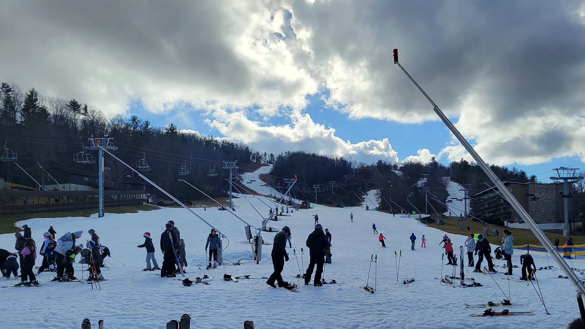 Skiers and snowboarders at the base of the slopes at Bryce Resort in Basye, Virginia, in winter