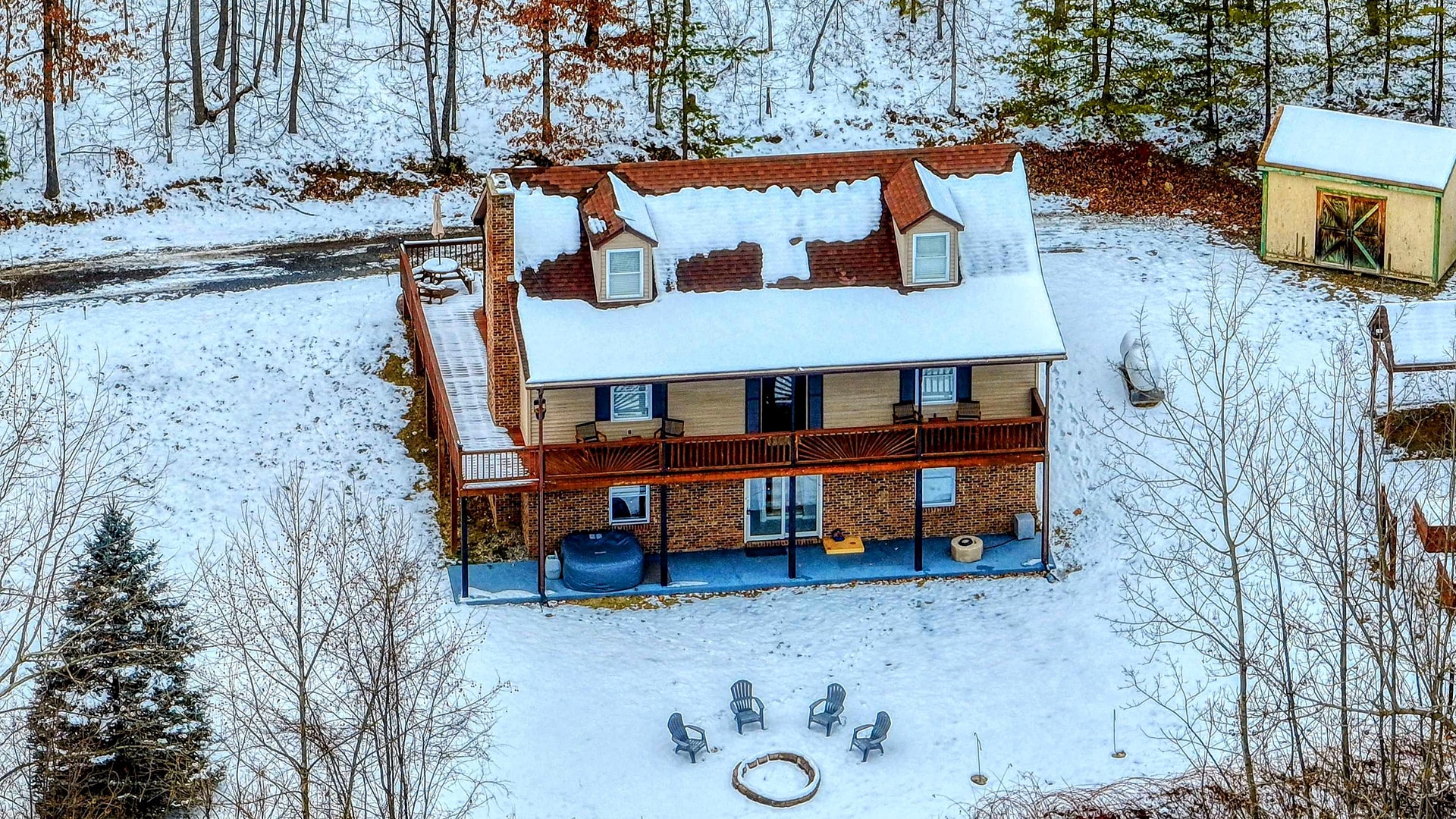 Sunrise Ridge, a Blue Maple cabin near Luray, Virginia, surrounded by snow on its wooded acreage
