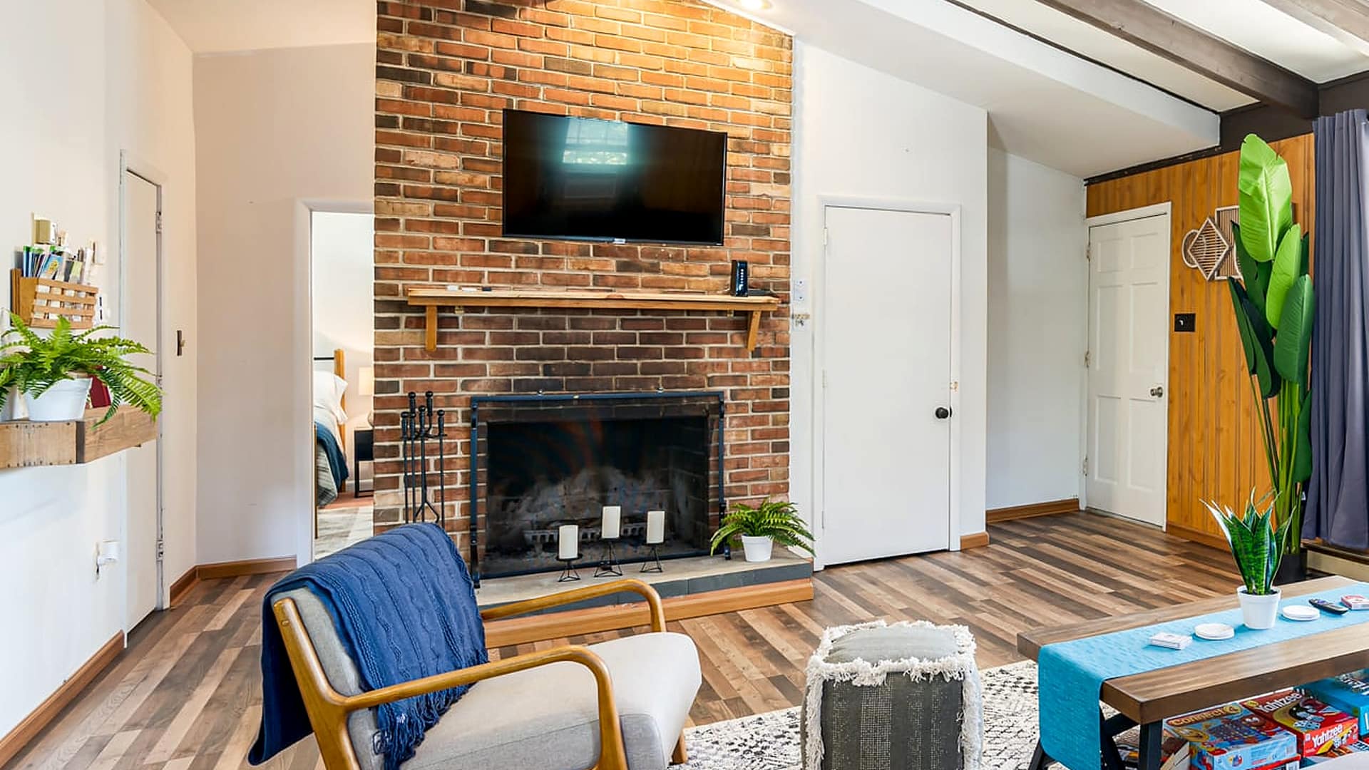 Brick fireplace in the living room at Little Fawn, a Blue Maple cabin near Luray, Virginia