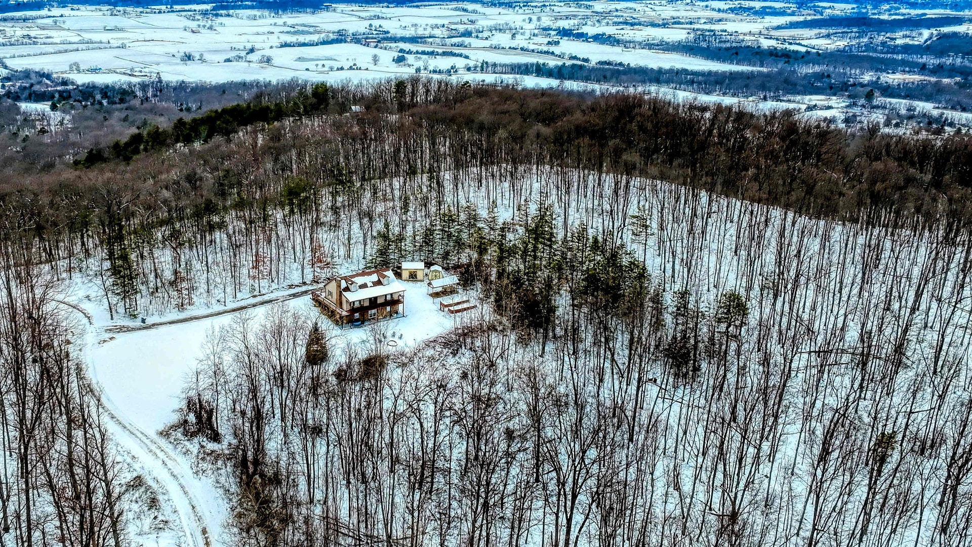 Snowy aerial view of Sunrise Ridge, a Blue Maple cabin near Luray, with the Shenandoah Valley beyond