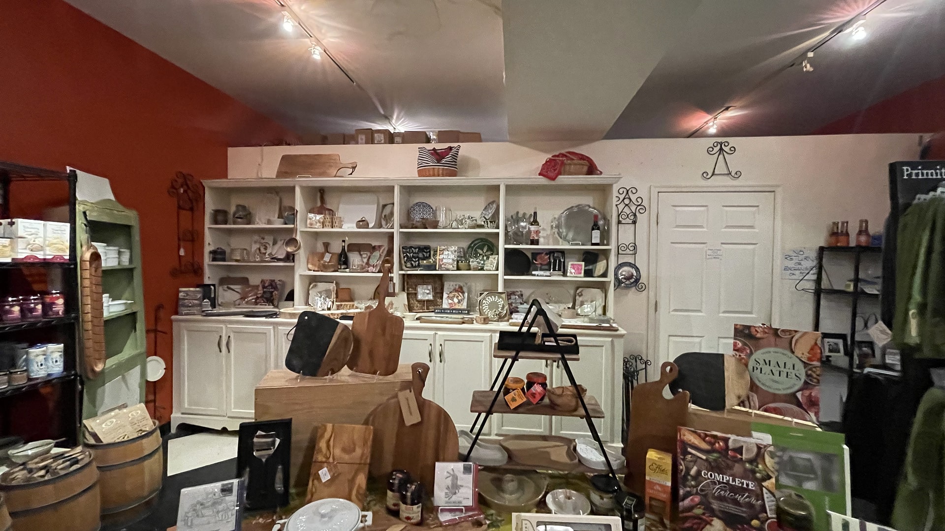Shelves of kitchen goods, gifts, and gourmet foods inside German Street Coffee & Candlery