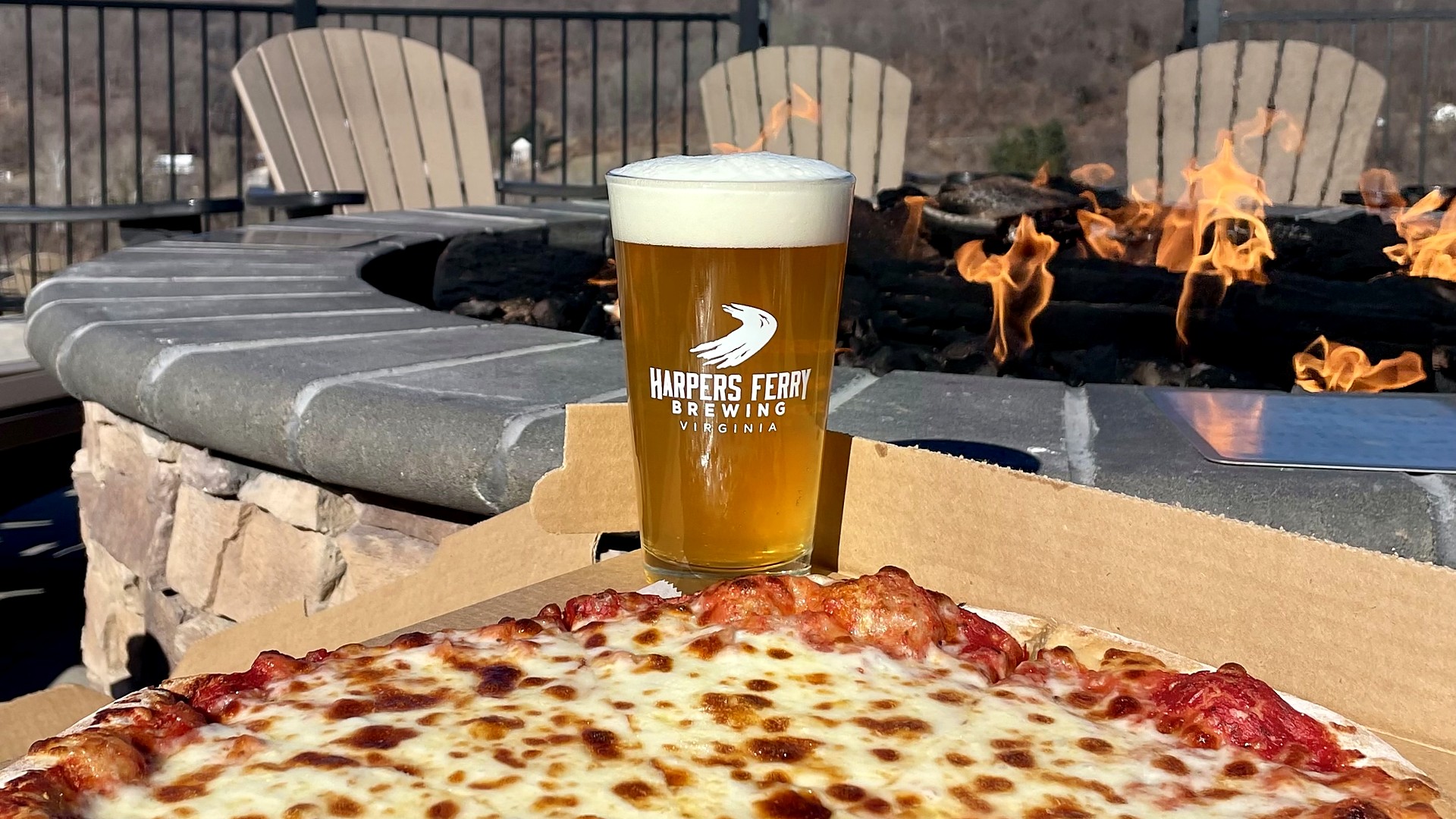 Beer and pizza by the fire pit at Harpers Ferry Brewing