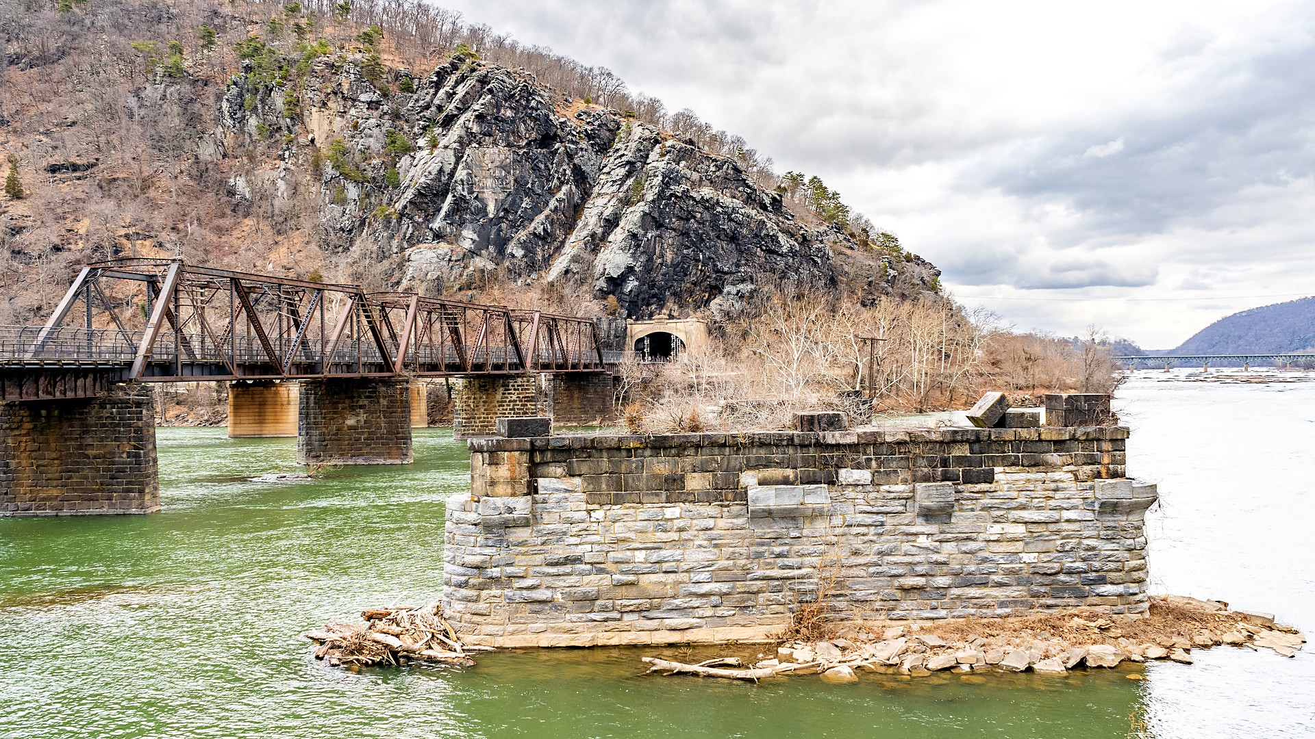 Old railroad bridge piers on the Potomac River at Harpers Ferry National Historical Park in winter