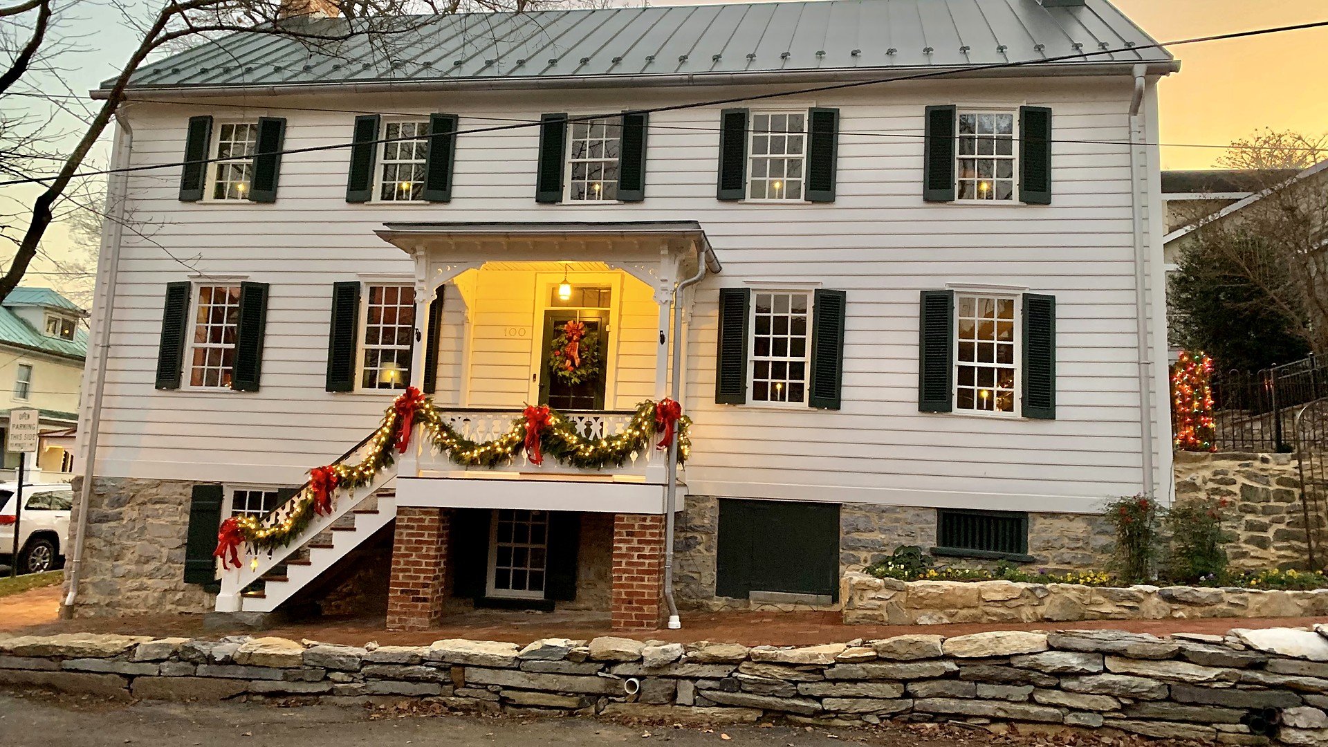 Historic house in Shepherdstown, WV decorated with Christmas garland and wreaths
