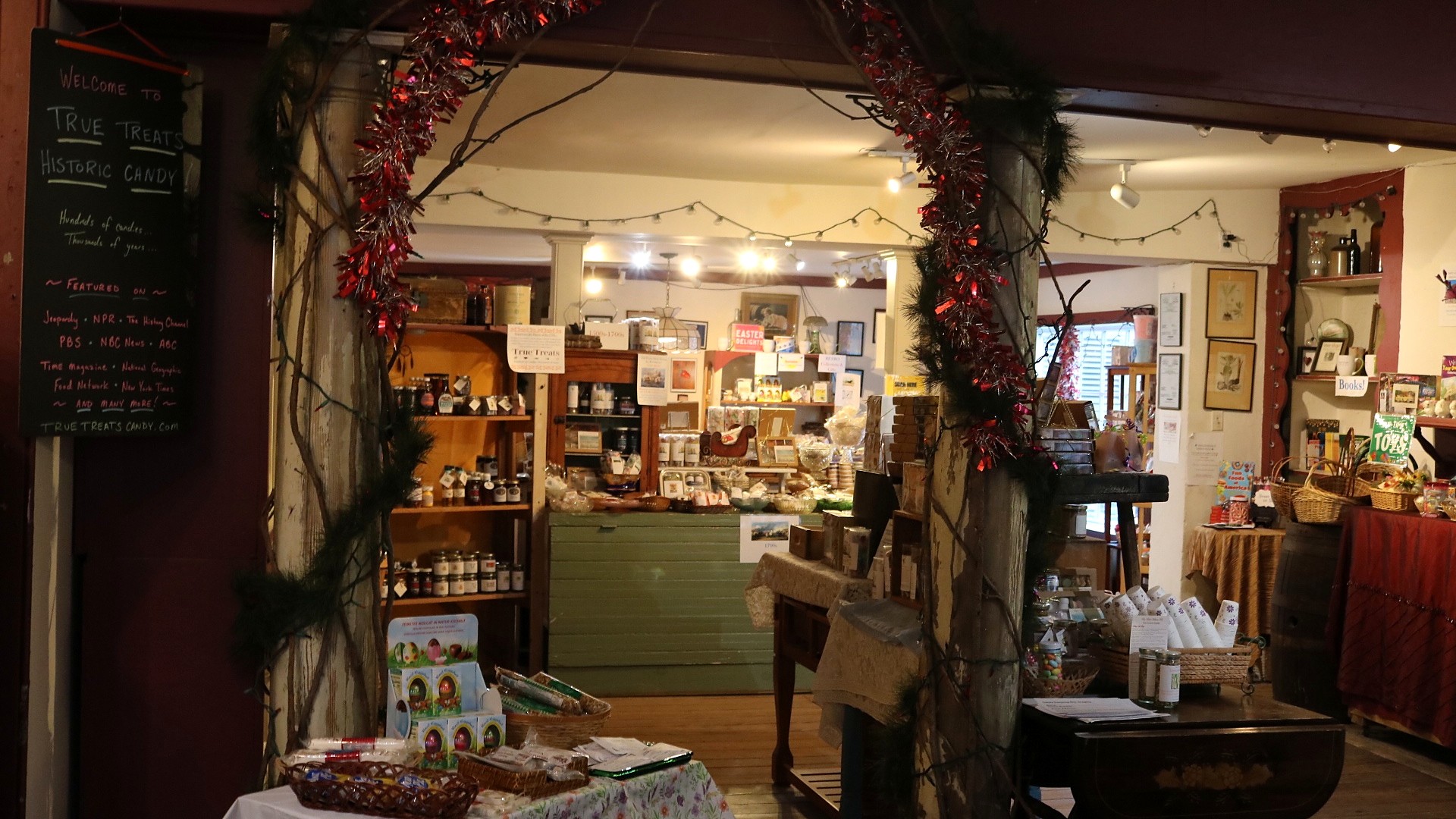 Entrance to True Treats Historic Candy in Harpers Ferry decorated with garland and lights